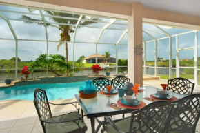 Tommy Bahama-style electric-heated pool home on Gulf-access canal - Villa Ellis